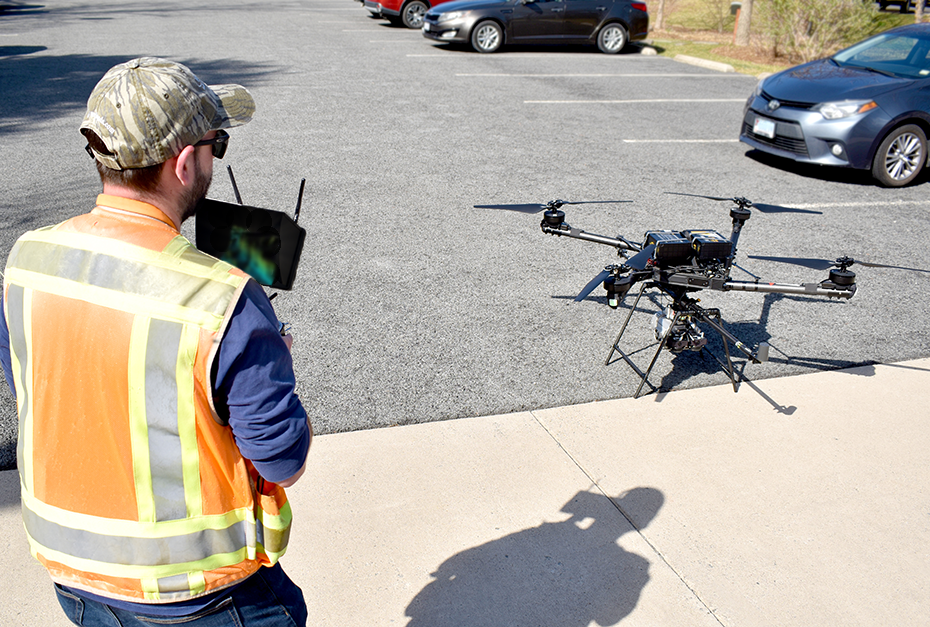 Jim Quirin preparing a drone for flight.